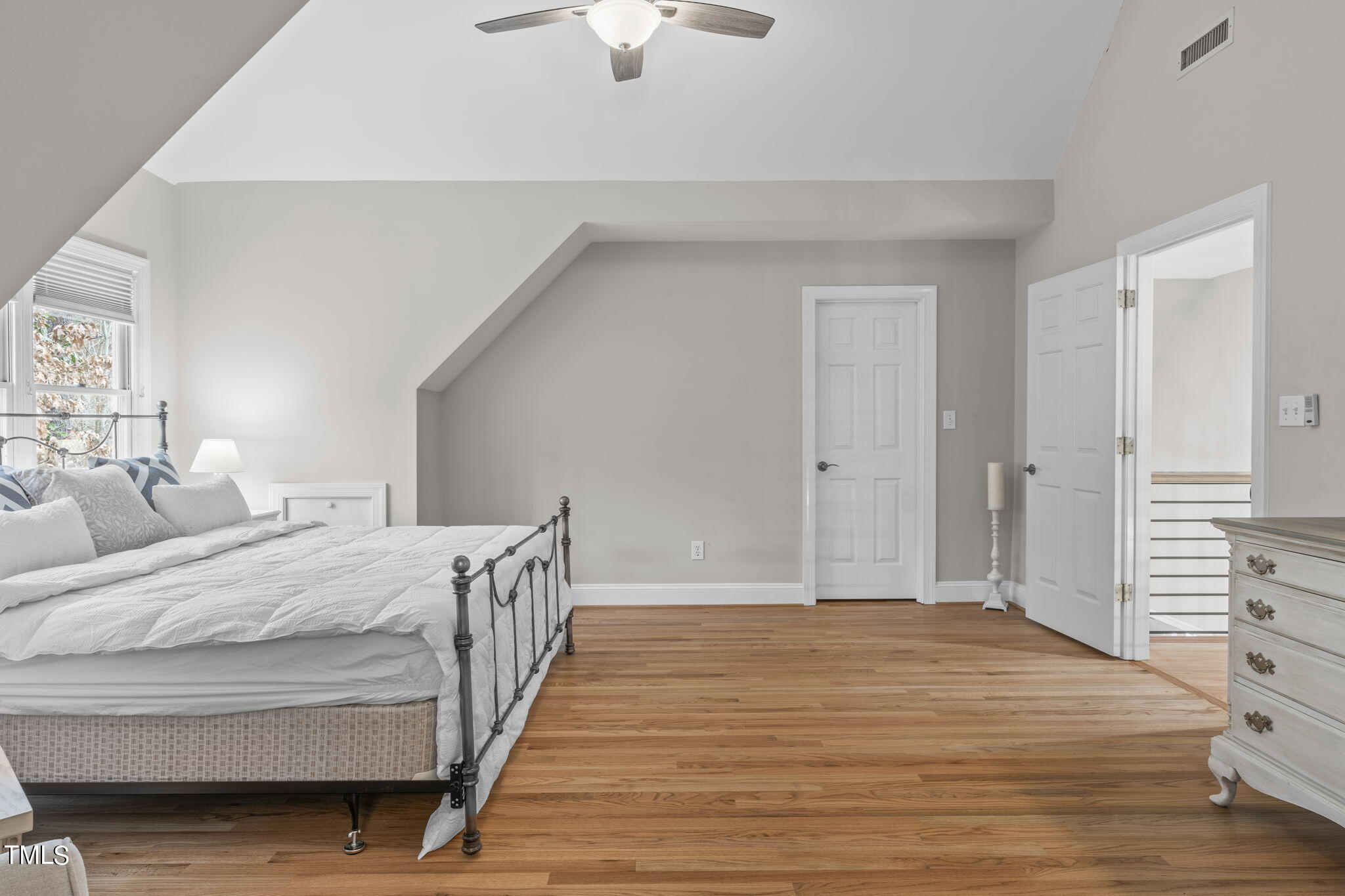 201 Claflin Court Raleigh, NC 27614 - Photo 54 of 73 a bedroom with a bed and a dresser