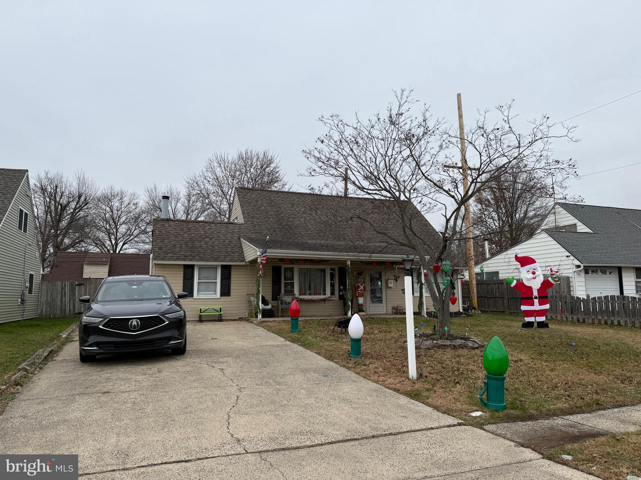 83 Indigo Road Levittown, PA 19057 - Photo 1 of 37 a front view of a house with a garden and car parked