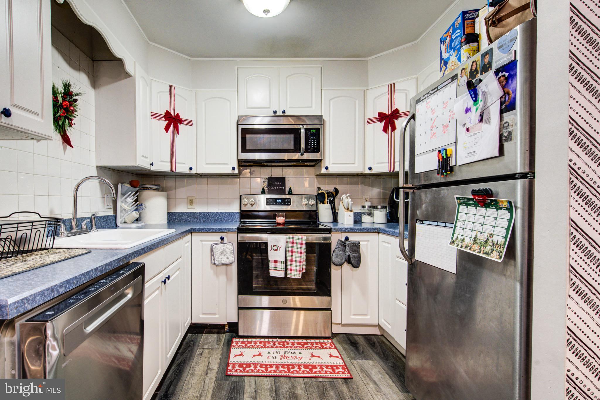 83 Indigo Road Levittown, PA 19057 - Photo 17 of 37 a kitchen with stainless steel appliances and cabinets