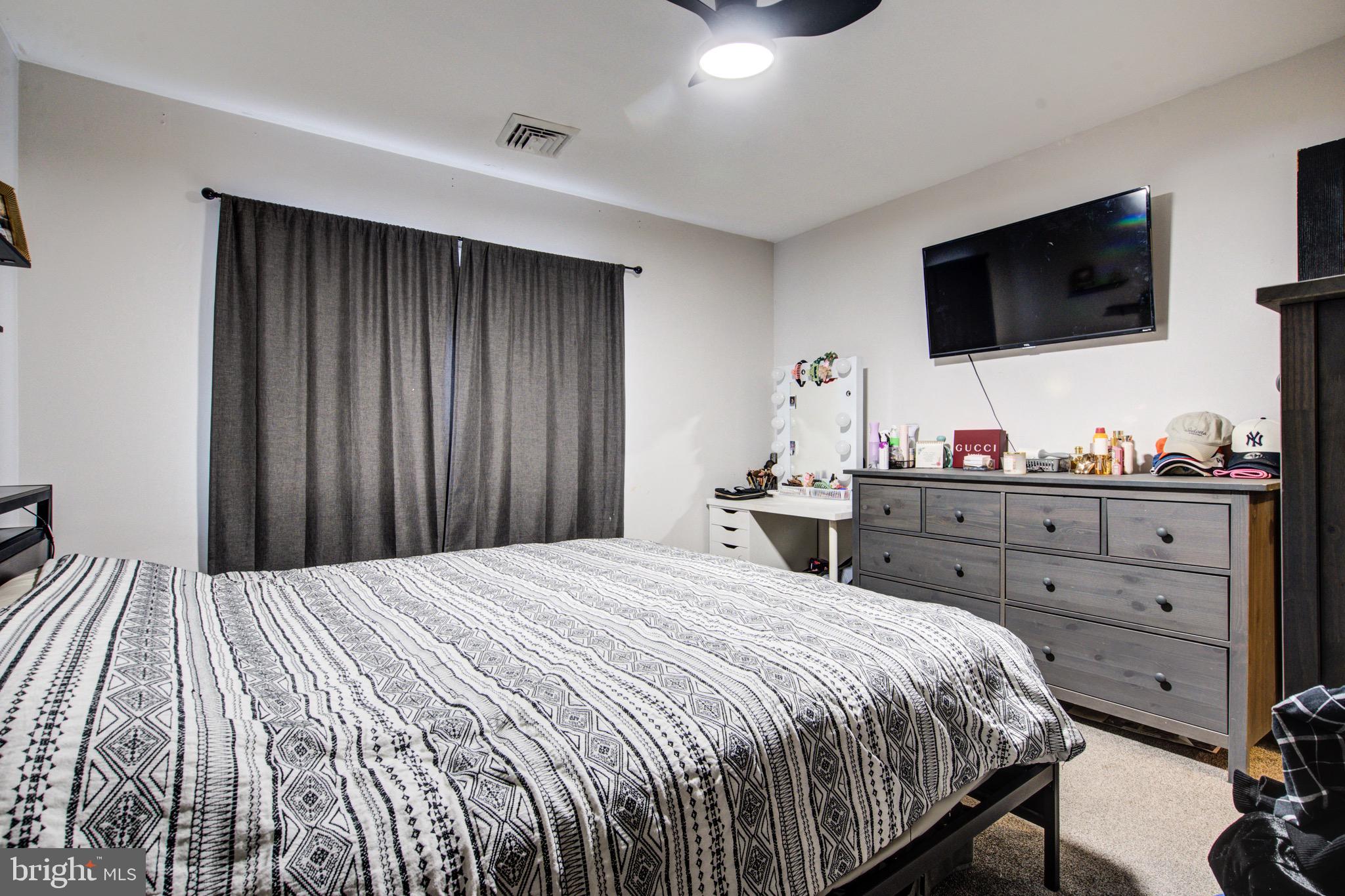 83 Indigo Road Levittown, PA 19057 - Photo 21 of 37 a bedroom with a bed and a flat screen tv