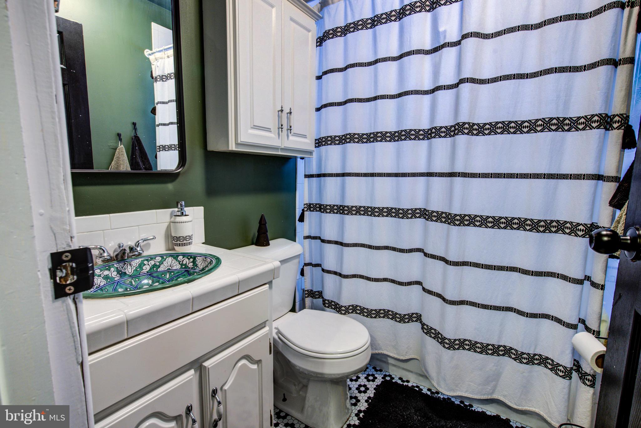 83 Indigo Road Levittown, PA 19057 - Photo 22 of 37 a bathroom with a sink and a toilet