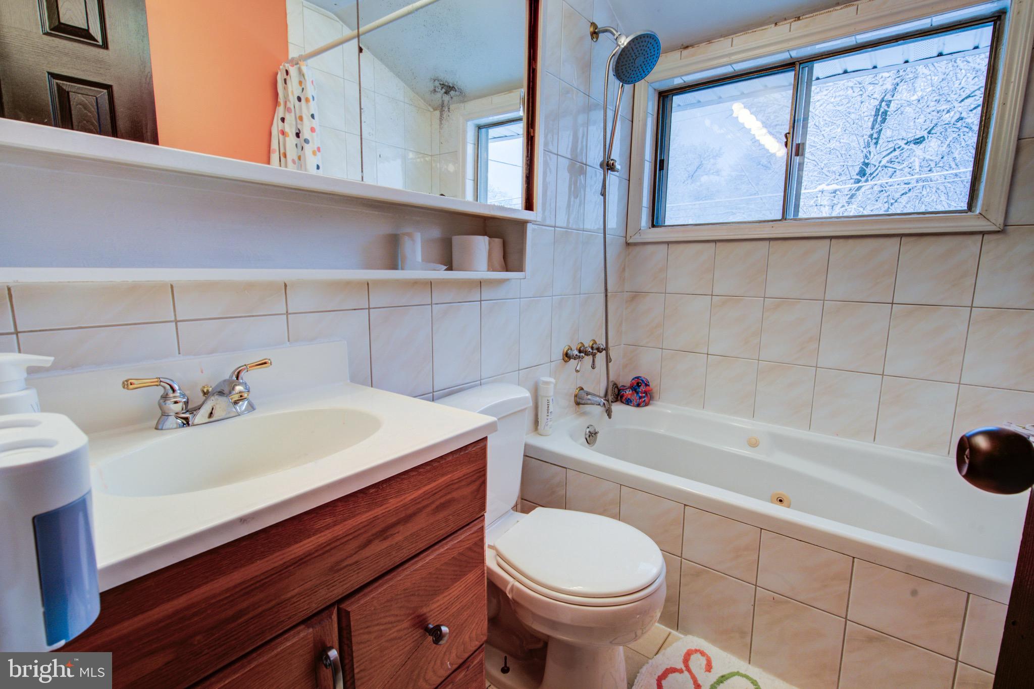 83 Indigo Road Levittown, PA 19057 - Photo 28 of 37 a bathroom with a sink a toilet and bathtub