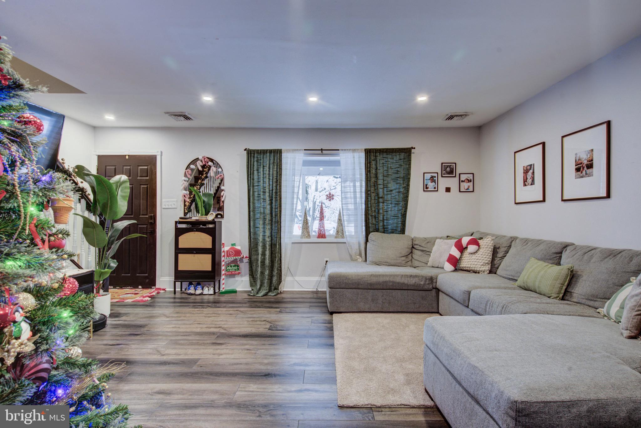 83 Indigo Road Levittown, PA 19057 - Photo 10 of 37 a living room with furniture and flowers