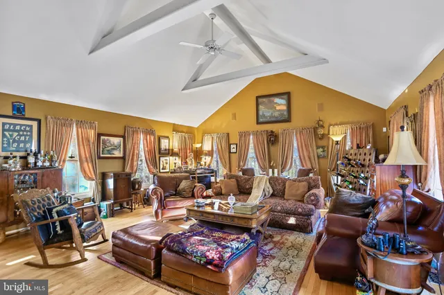 a living room with furniture fireplace and flat screen tv