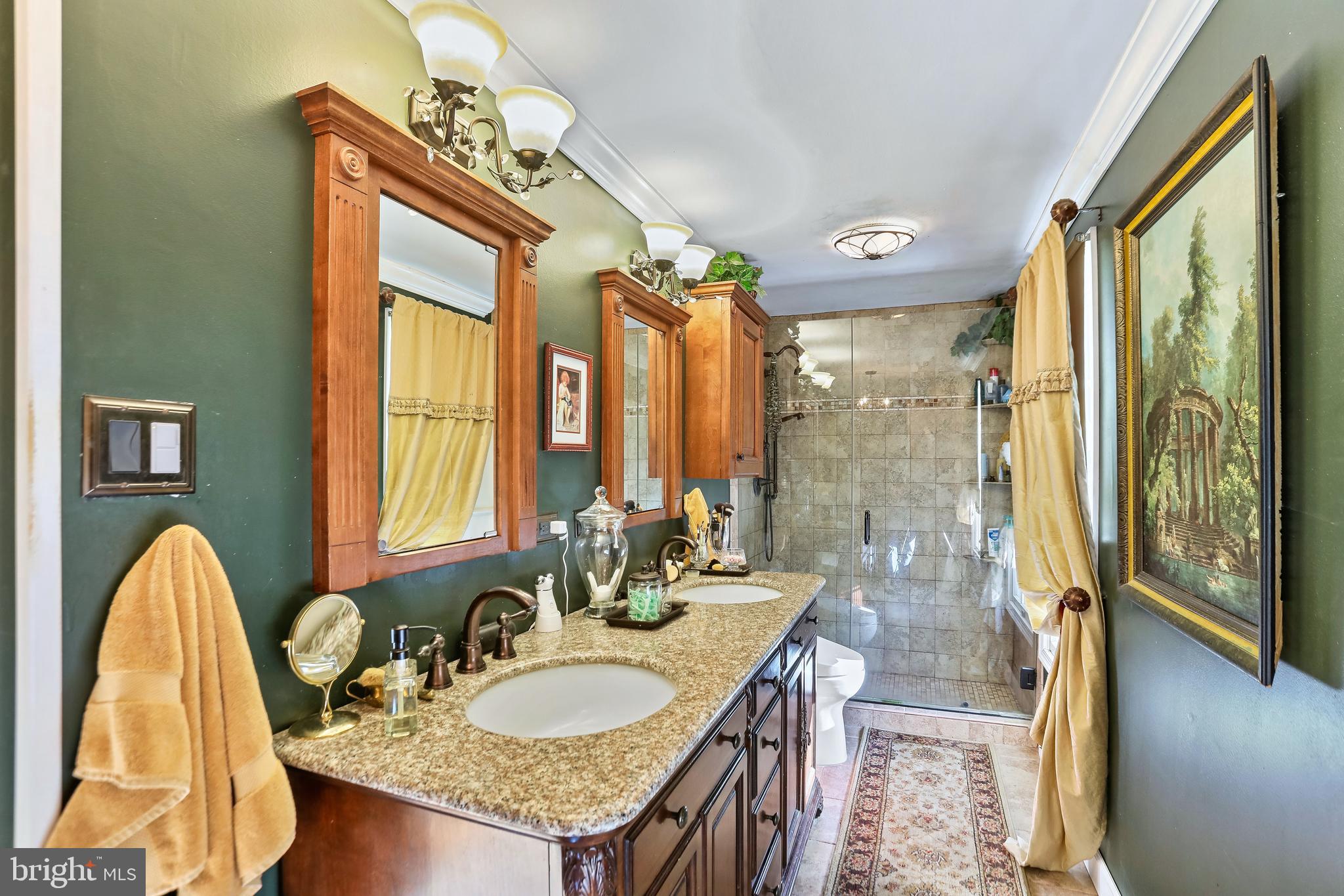 12080 Axline Road Lovettsville, VA 20180 - Photo 22 of 54 a bathroom with a granite countertop sink a mirror and a shower