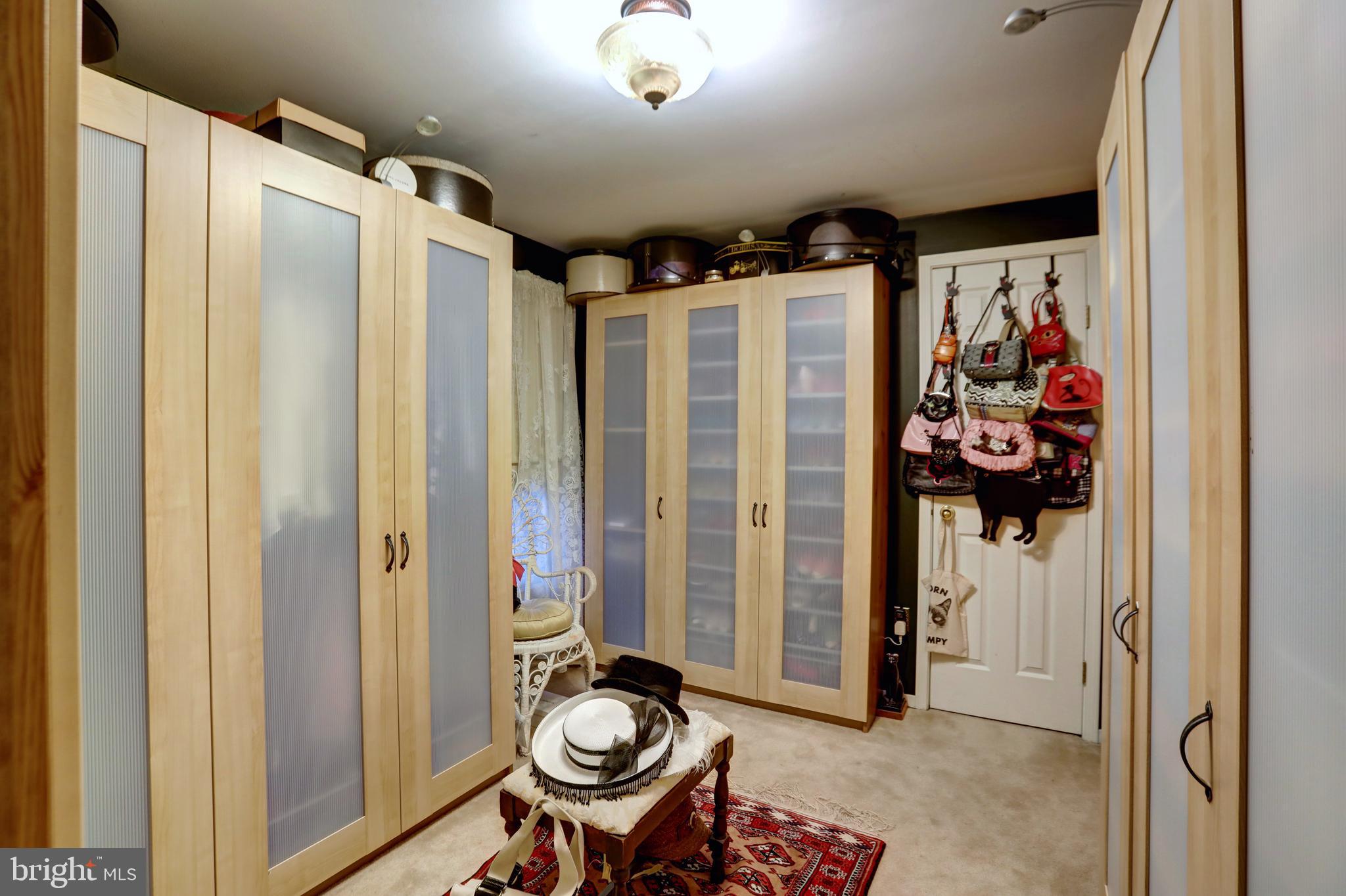 12080 Axline Road Lovettsville, VA 20180 - Photo 27 of 54 a view of walk in closet with clothes and shoes