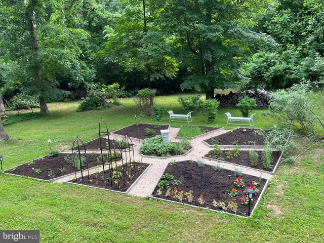 a view of a garden with an outdoor space