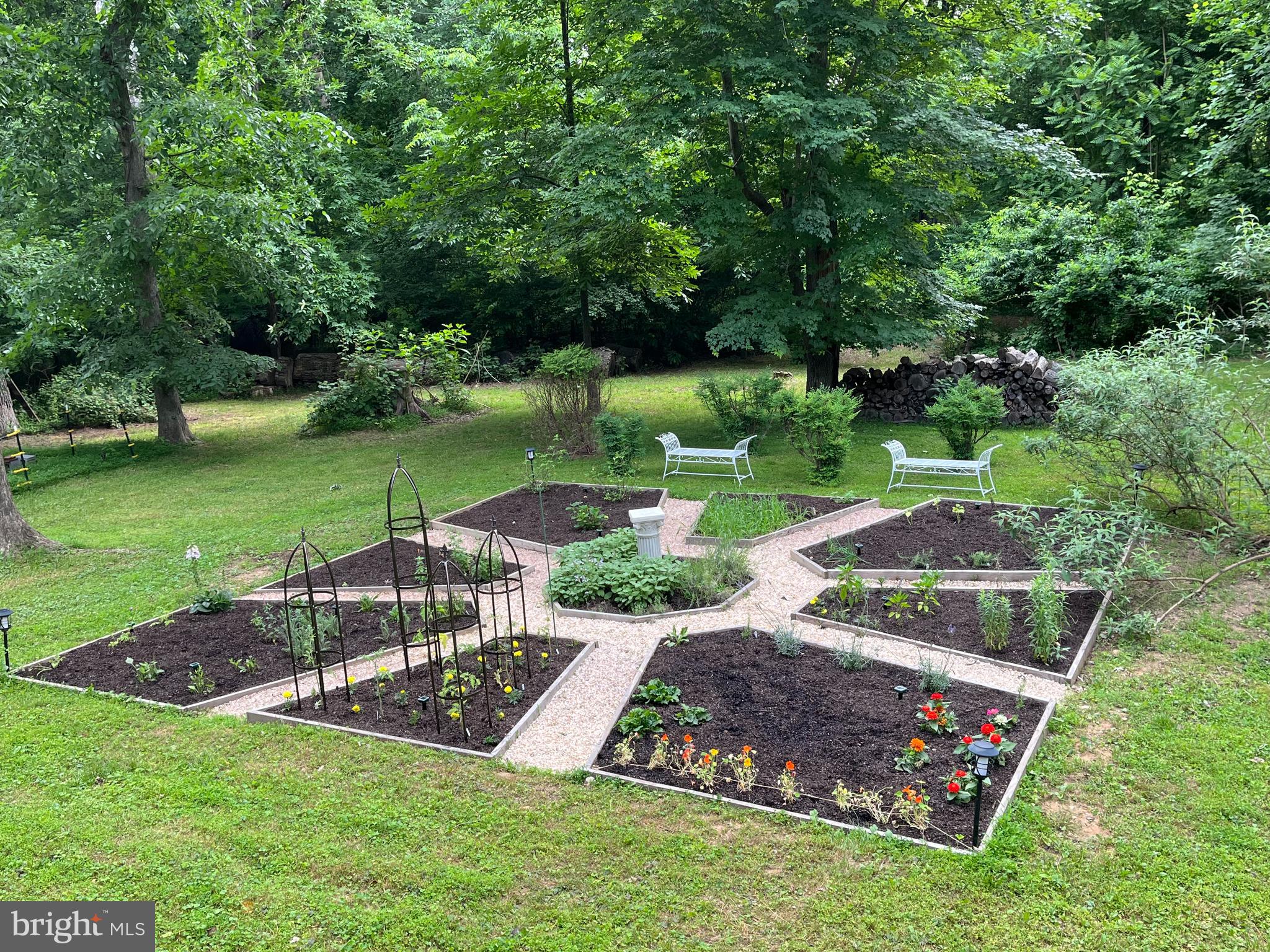 12080 Axline Road Lovettsville, VA 20180 - Photo 34 of 54 a view of a garden with an outdoor space
