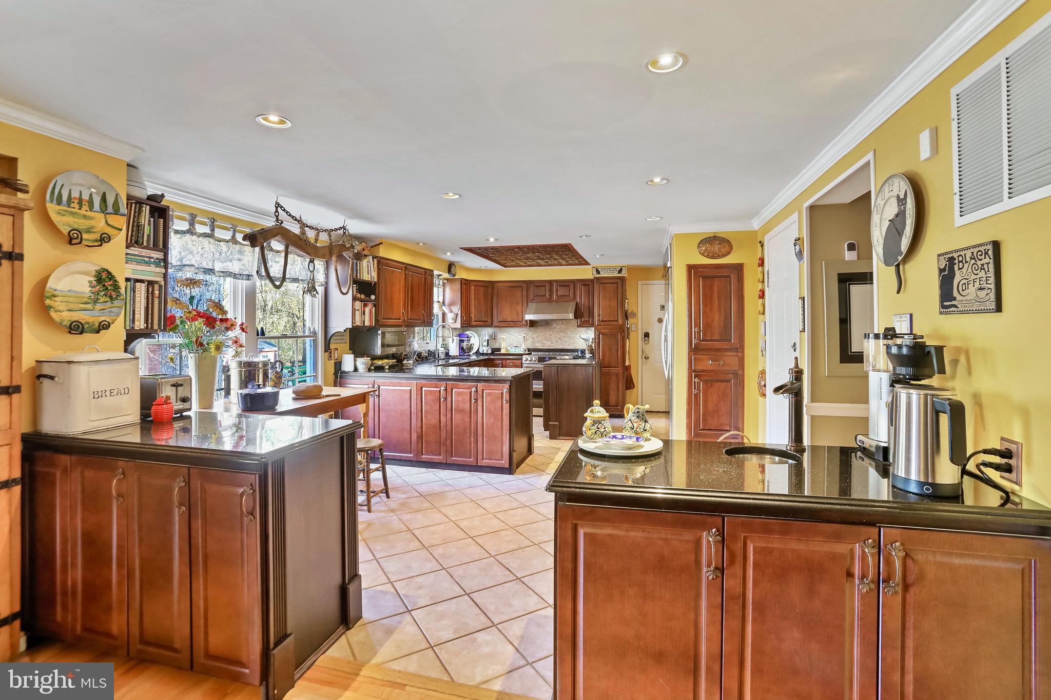 12080 Axline Road Lovettsville, VA 20180 - Photo 6 of 54 a kitchen with stainless steel appliances kitchen island granite countertop a sink and cabinets