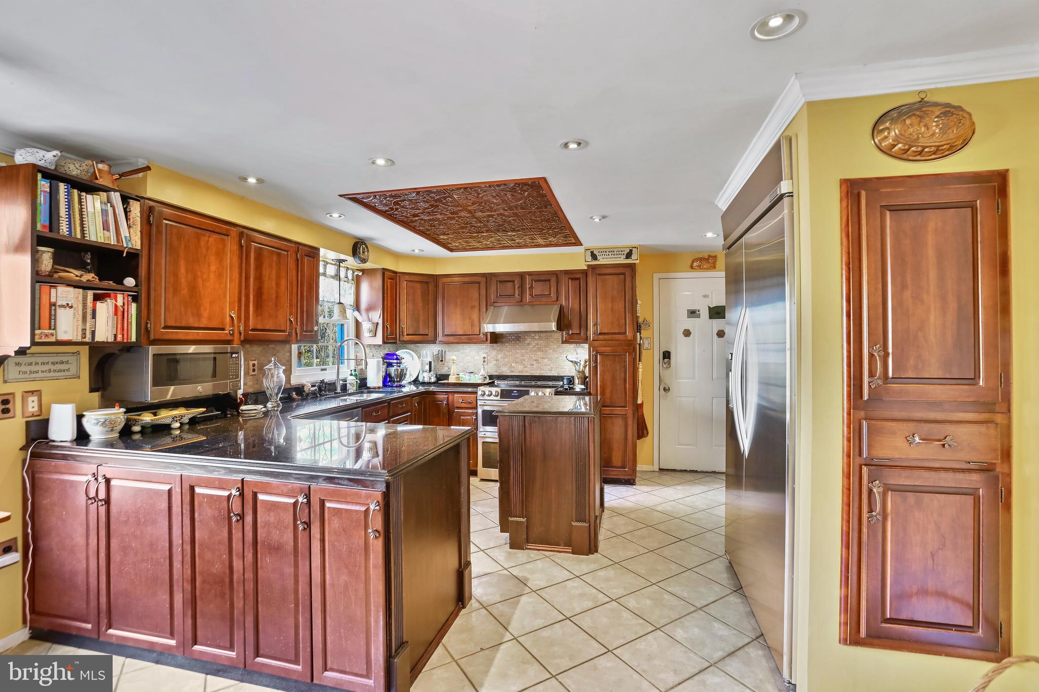 12080 Axline Road Lovettsville, VA 20180 - Photo 7 of 54 a kitchen with stainless steel appliances granite countertop a refrigerator and a stove top oven