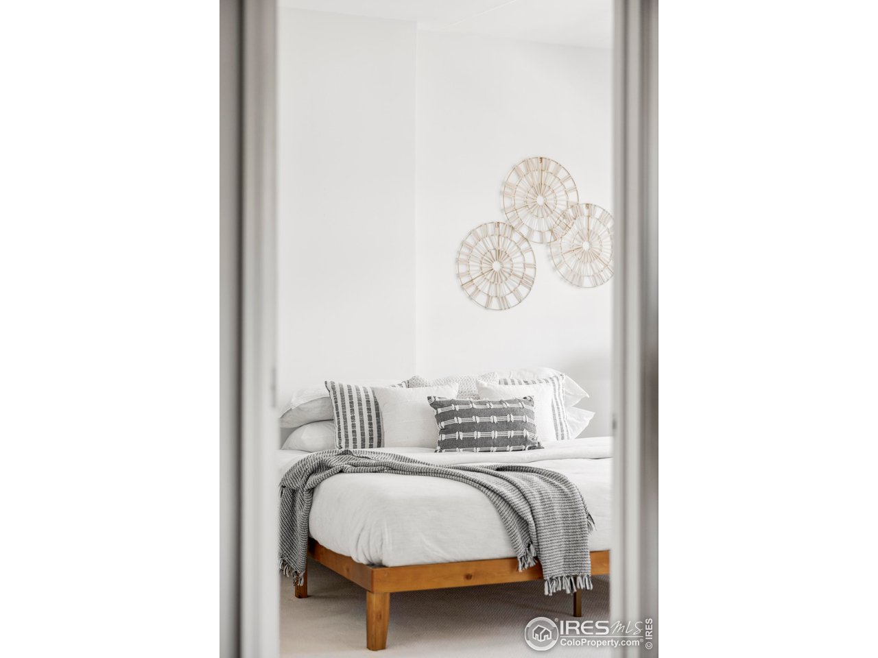 1950 Logan Street, Unit 1013 Denver, CO 80203 - Photo 11 of 23 a bedroom with a bed and a painting