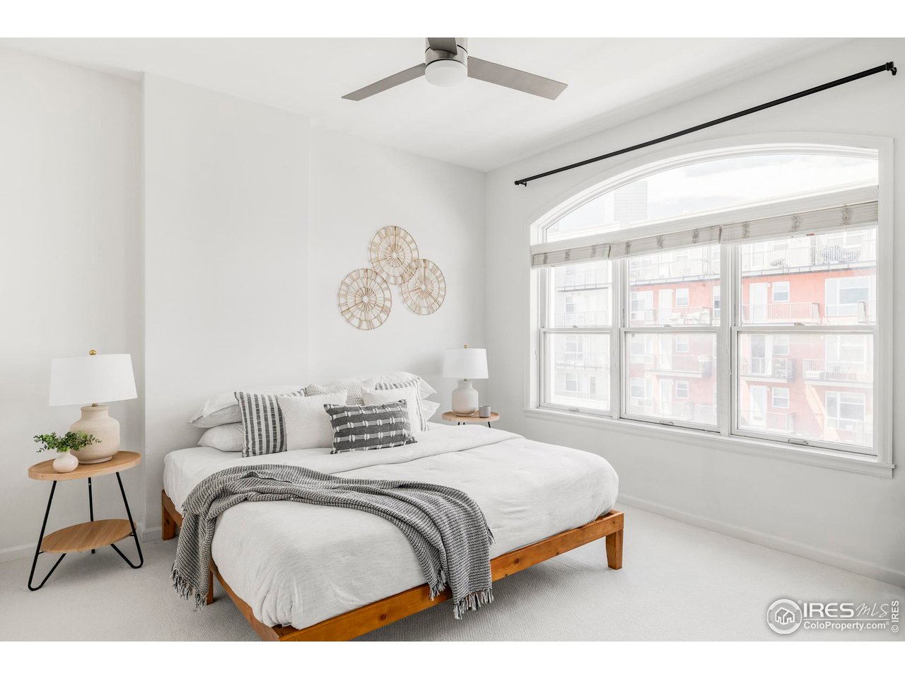 1950 Logan Street, Unit 1013 Denver, CO 80203 - Photo 12 of 23 a bedroom with a bed and a window