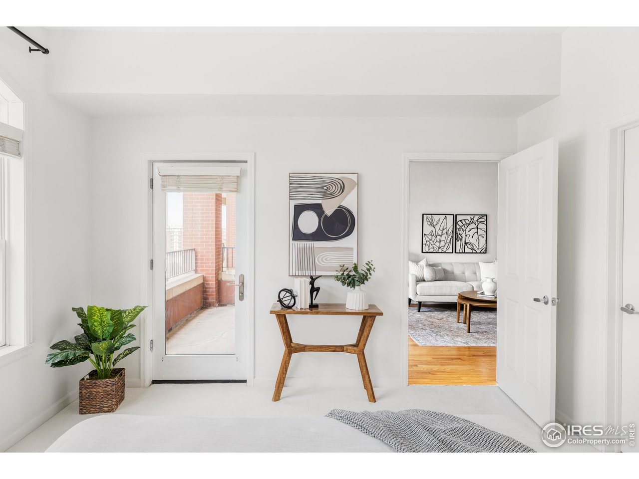 1950 Logan Street, Unit 1013 Denver, CO 80203 - Photo 14 of 23 a living room with furniture and a potted plant