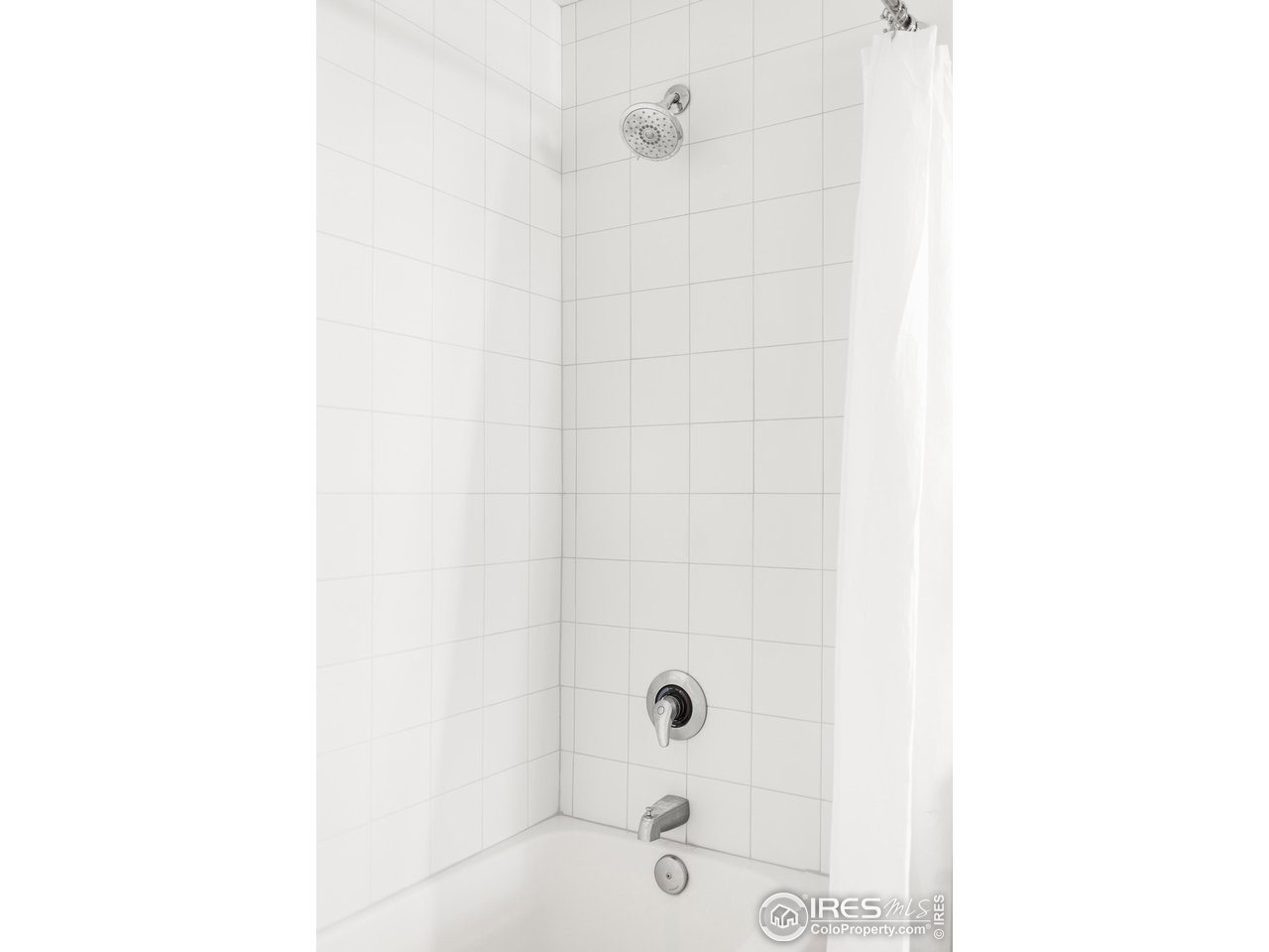1950 Logan Street, Unit 1013 Denver, CO 80203 - Photo 20 of 23 a bathroom with a bathtub and shower