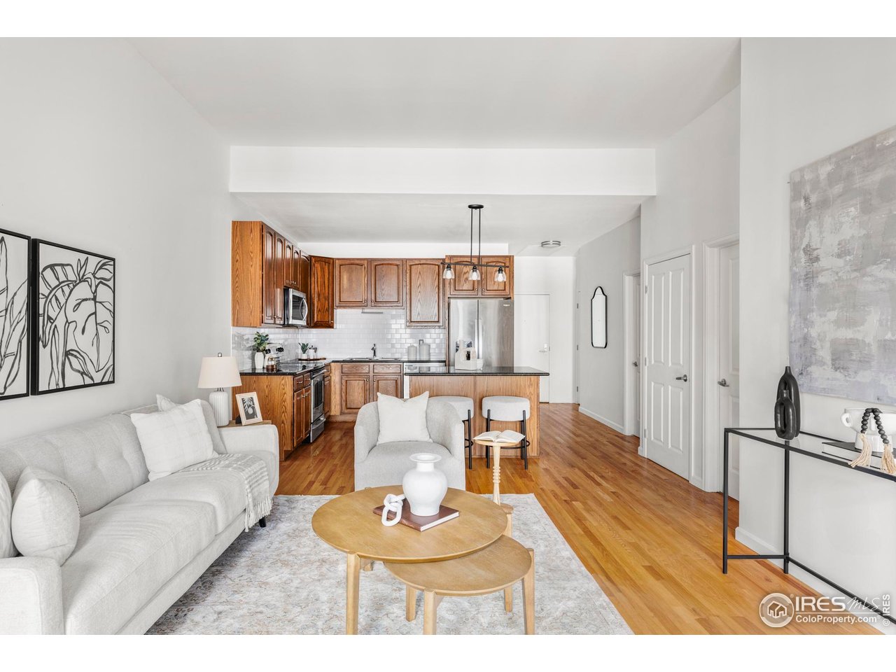 1950 Logan Street, Unit 1013 Denver, CO 80203 - Photo 2 of 23 a living room with furniture and a table