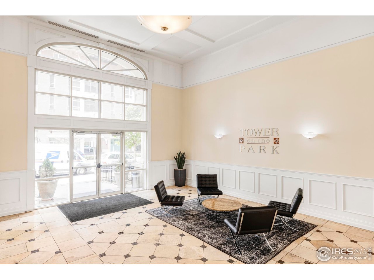 1950 Logan Street, Unit 1013 Denver, CO 80203 - Photo 22 of 23 a living room with furniture and a large window