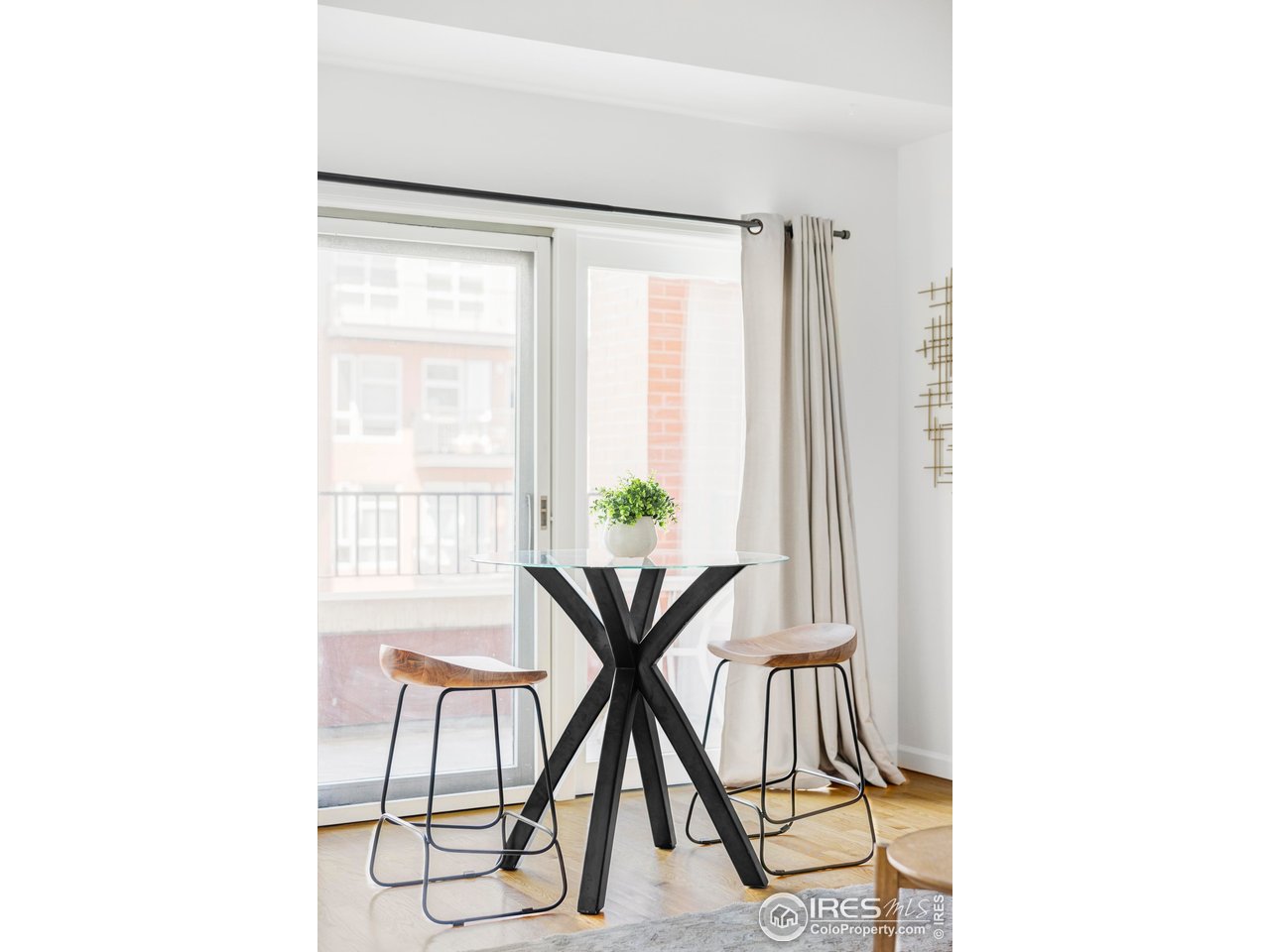 1950 Logan Street, Unit 1013 Denver, CO 80203 - Photo 10 of 23 a work place with a table and a potted plant