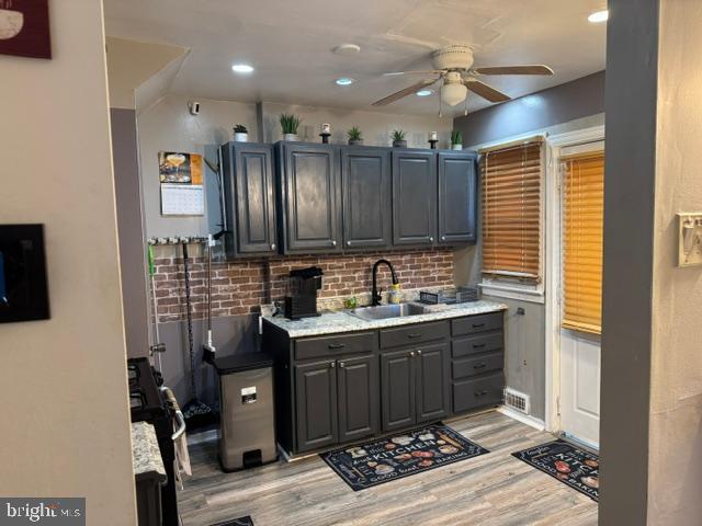 4603 Raleigh Road Temple Hills, MD 20748 - Photo 7 of 40 a kitchen with stainless steel appliances granite countertop a sink stove and cabinets