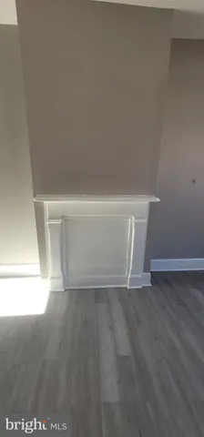 a white toilet sitting next to a white sink