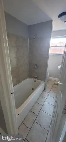 a bathroom with a sink and a window