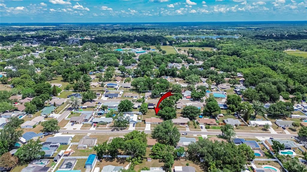 2340 Merrily Circle South Seffner, FL 33584 - Photo 6 of 52 an aerial view of residential houses with outdoor space and trees all around