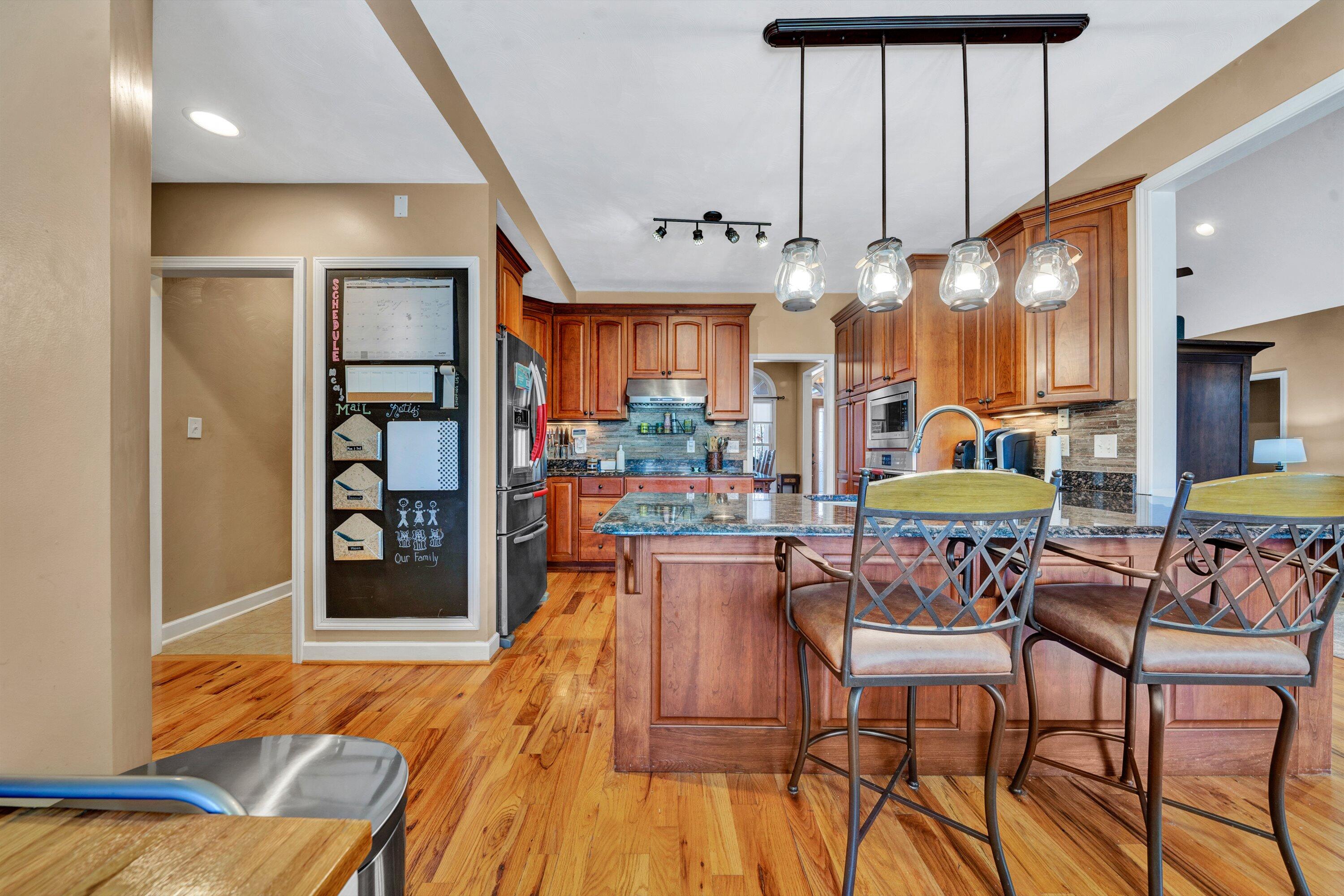 1170 Loggers Road Goodview, VA 24095 - Photo 17 of 55 a dining room with furniture and chandelier