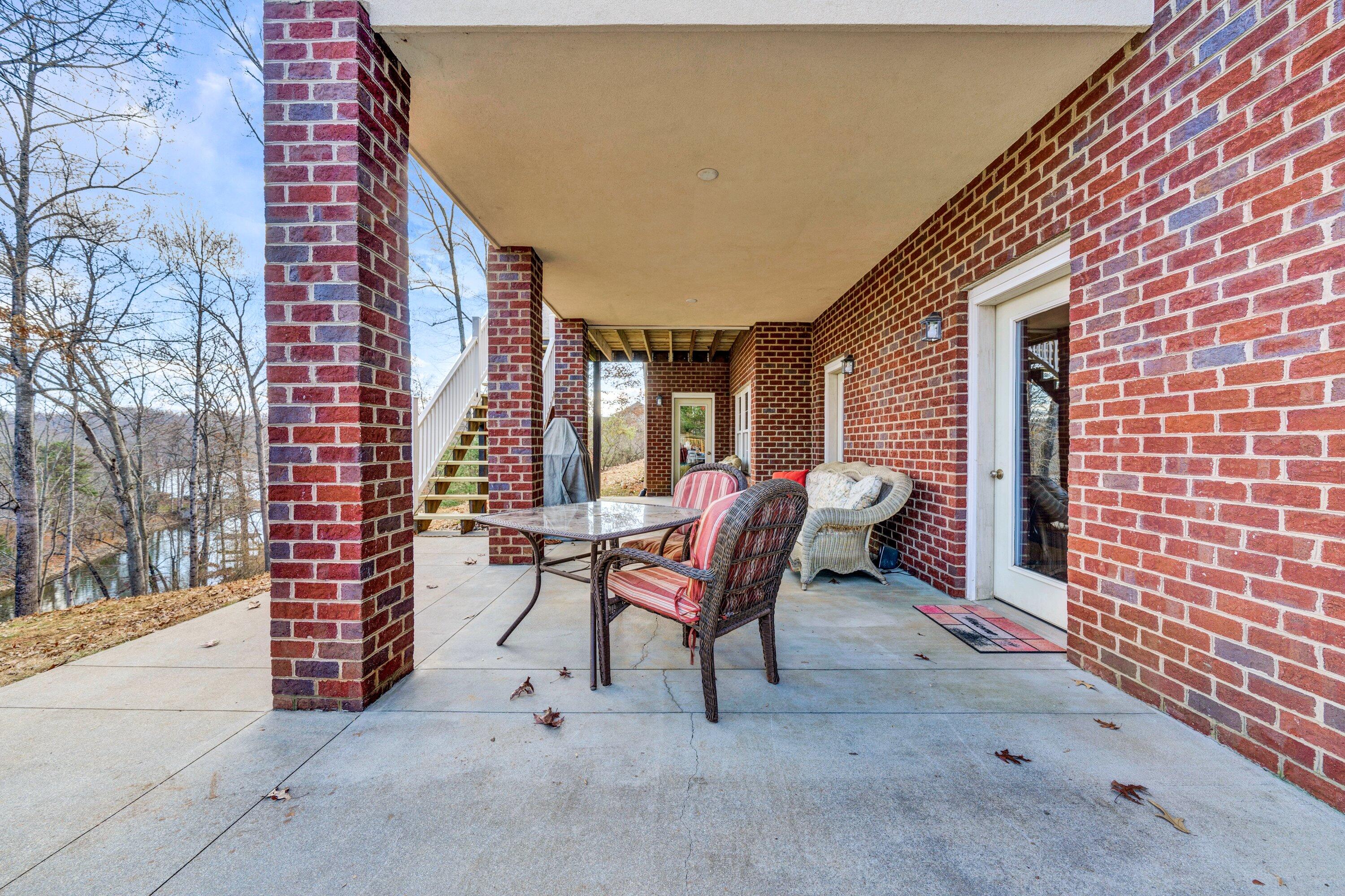 1170 Loggers Road Goodview, VA 24095 - Photo 44 of 55 a view of a patio with a table and chairs