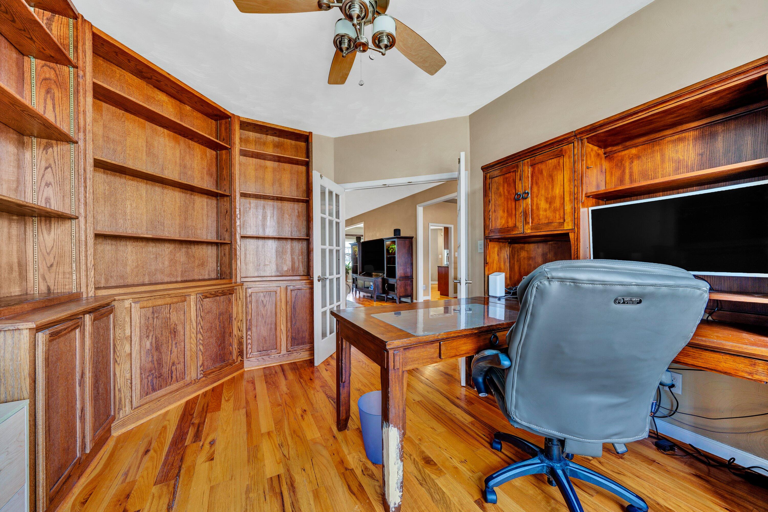 1170 Loggers Road Goodview, VA 24095 - Photo 10 of 55 a view of a workspace with furniture and wooden floor