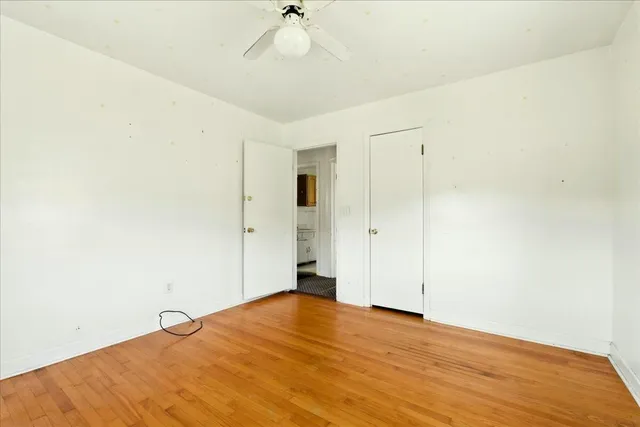 a backyard of a house with a yard and outdoor seating