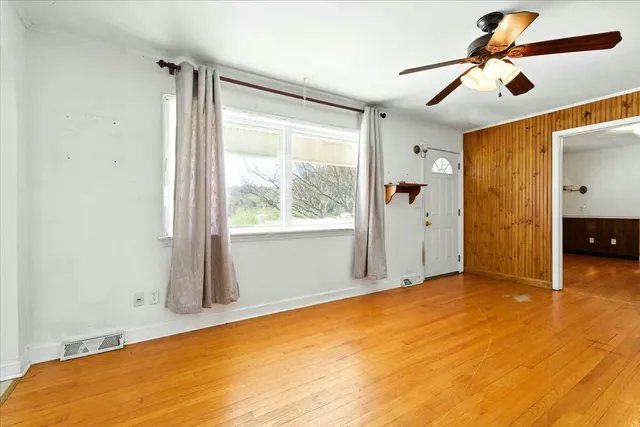 a view of an empty room with a window