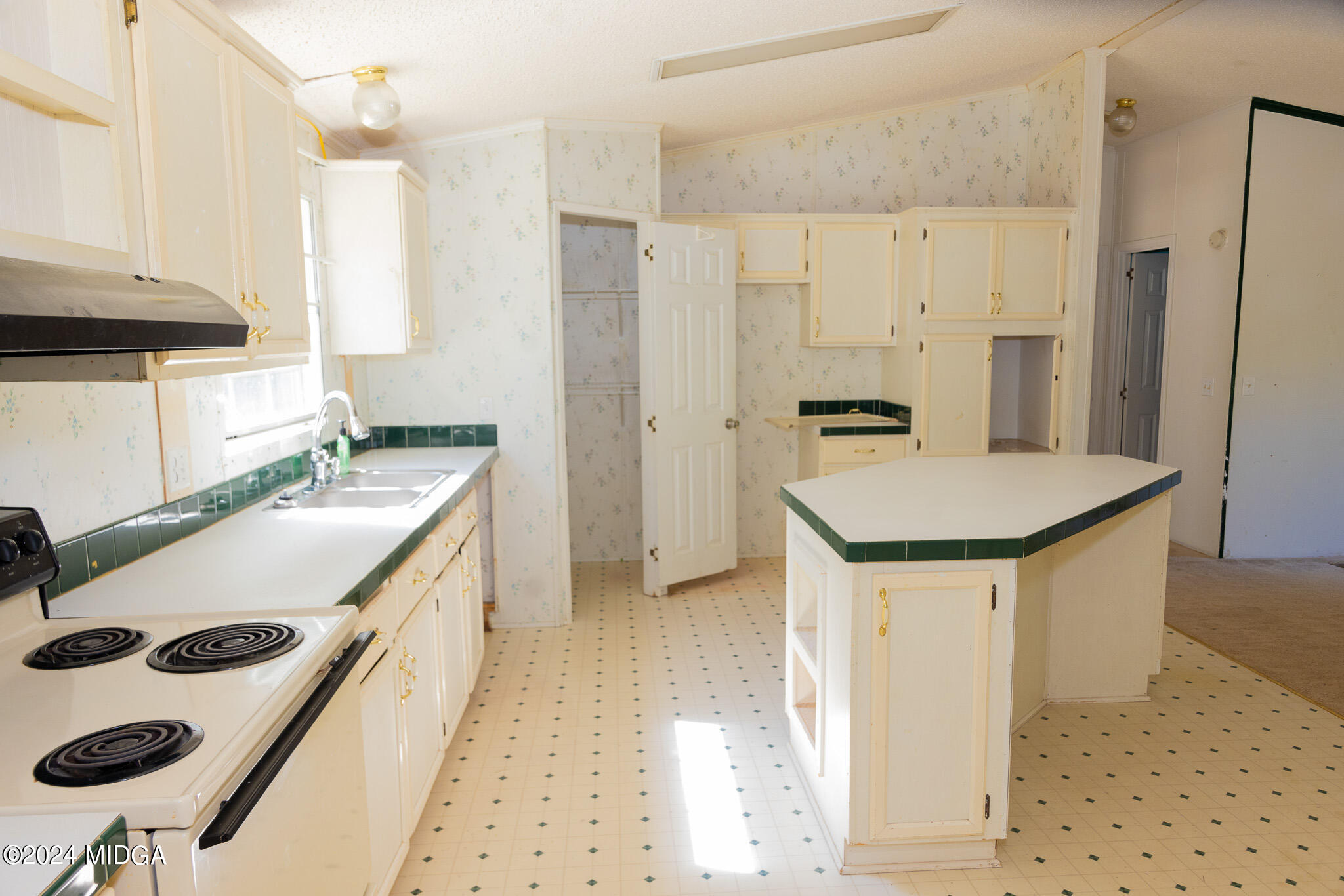 4687 Boxankle Road Jackson, GA 30233 - Photo 13 of 37 a kitchen with a sink a stove and refrigerator