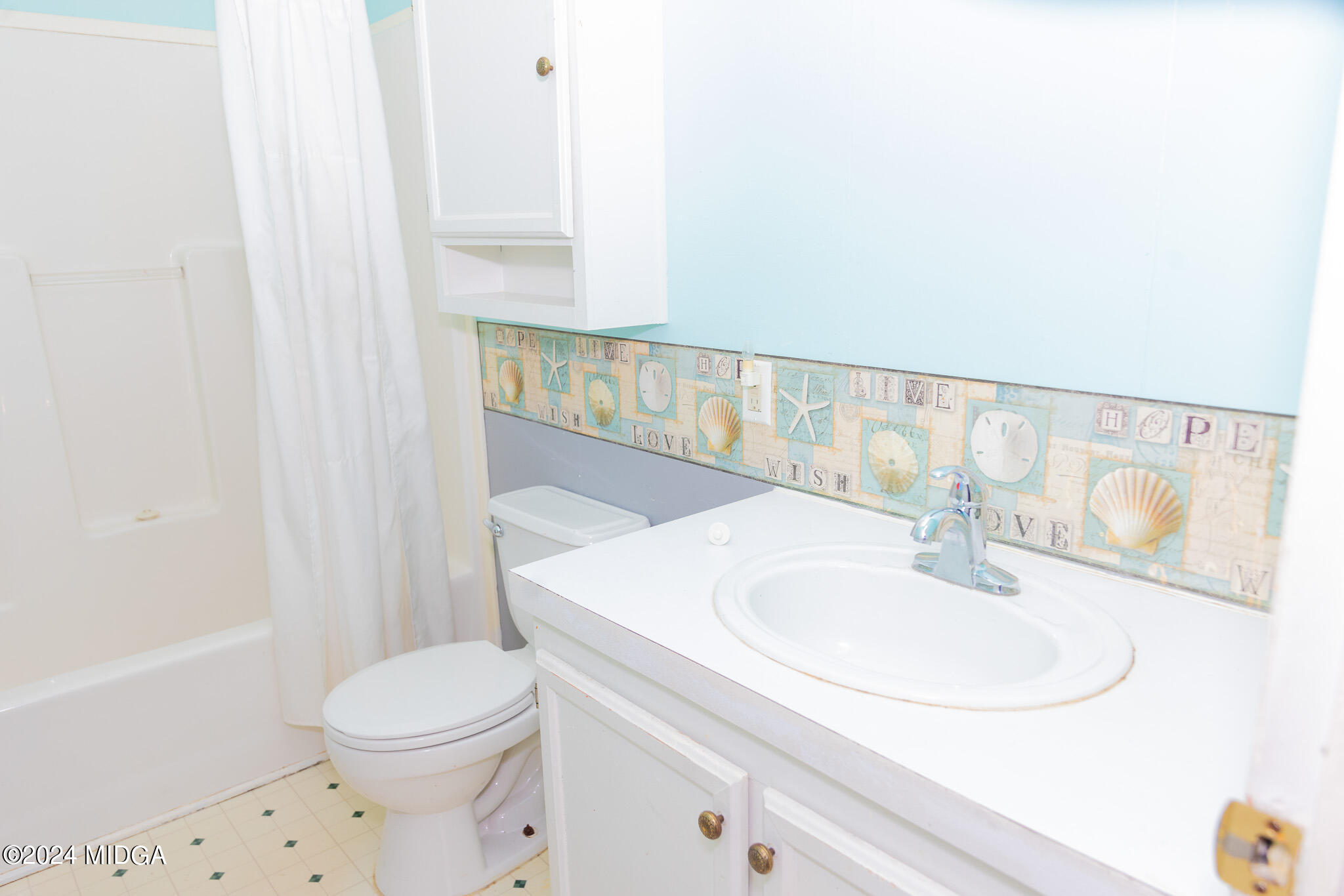 4687 Boxankle Road Jackson, GA 30233 - Photo 21 of 37 a bathroom with a sink a toilet and vanity