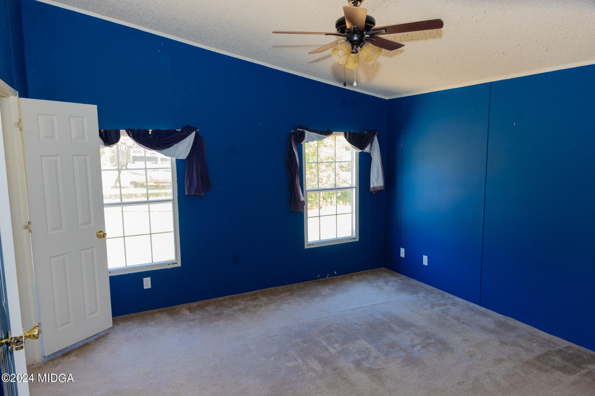 4687 Boxankle Road Jackson, GA 30233 - Photo 23 of 37 an empty room with windows and fan