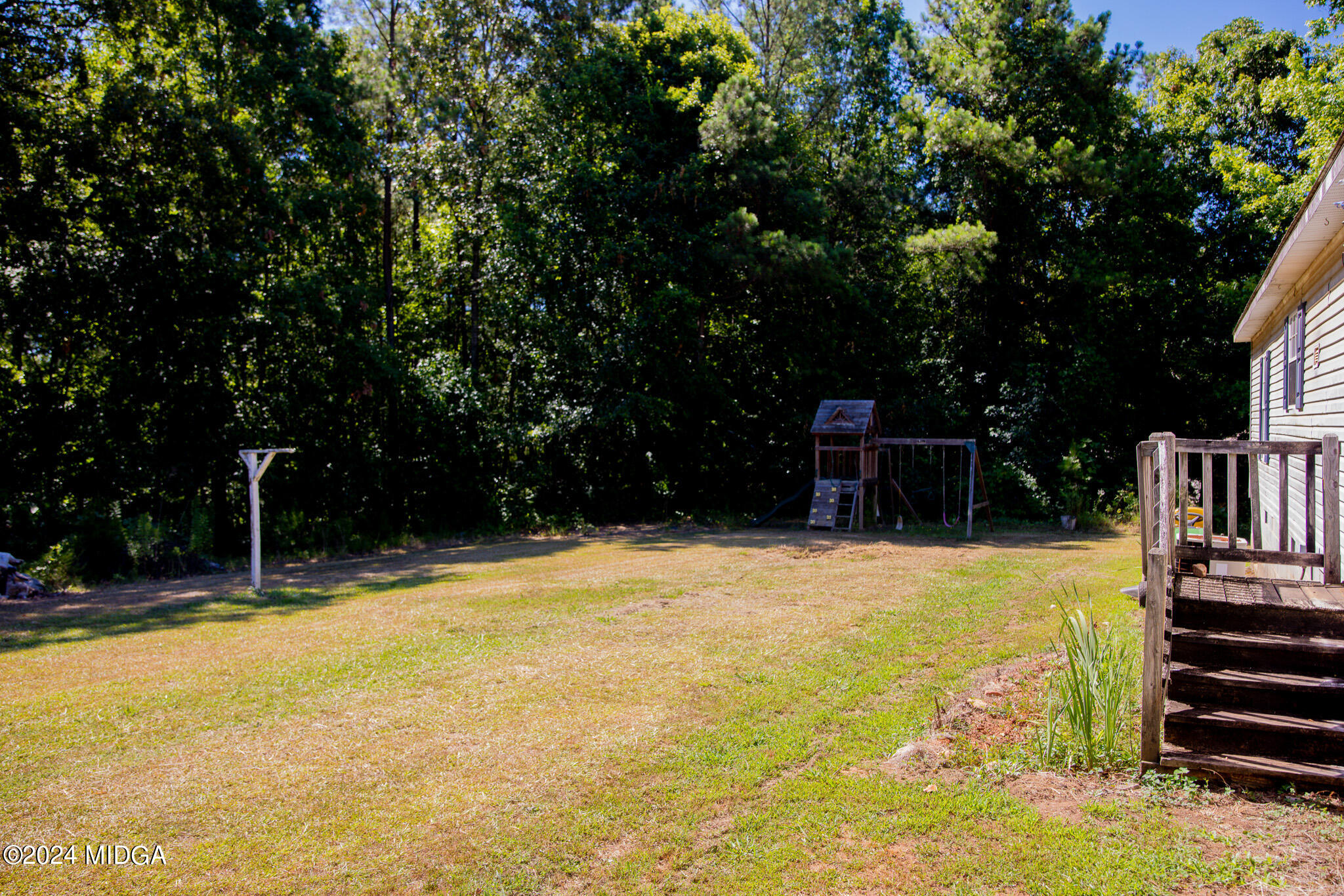 4687 Boxankle Road Jackson, GA 30233 - Photo 33 of 37 a view of a swimming pool with a yard and trees