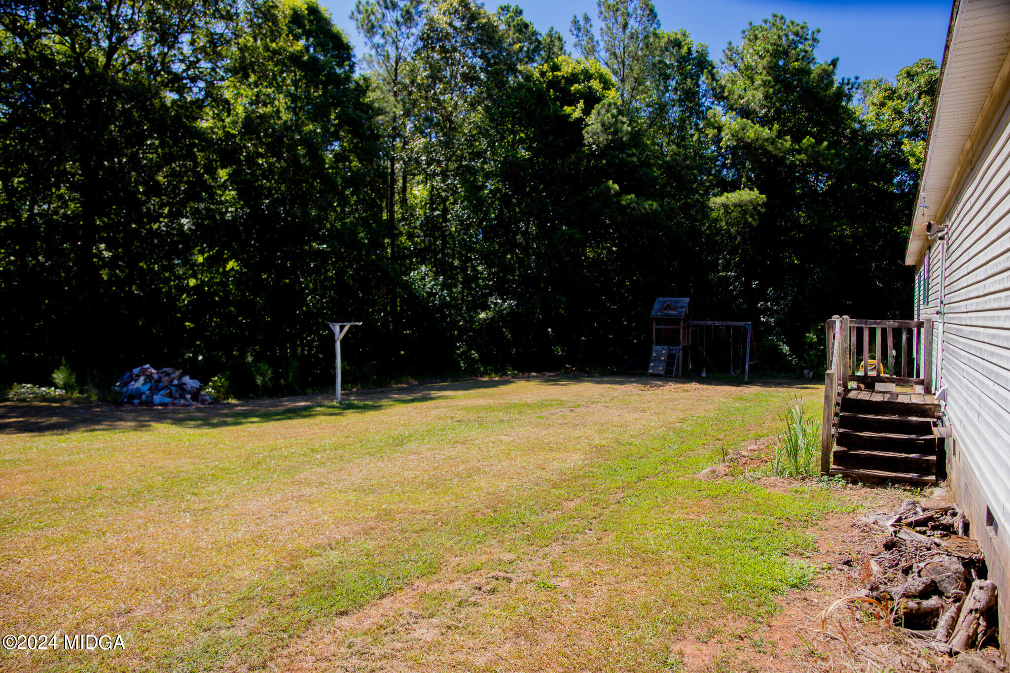 4687 Boxankle Road Jackson, GA 30233 - Photo 34 of 37 a view of a swimming pool with an outdoor space and seating area