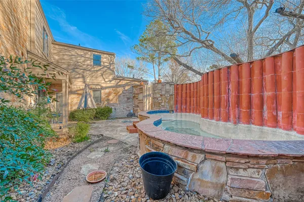 a view of backyard with a table and chairs