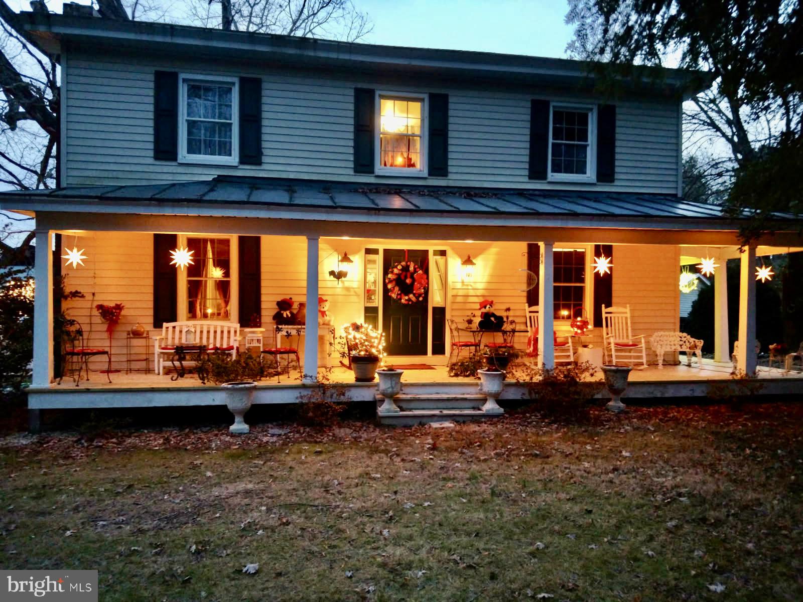a view of a brick house with large windows