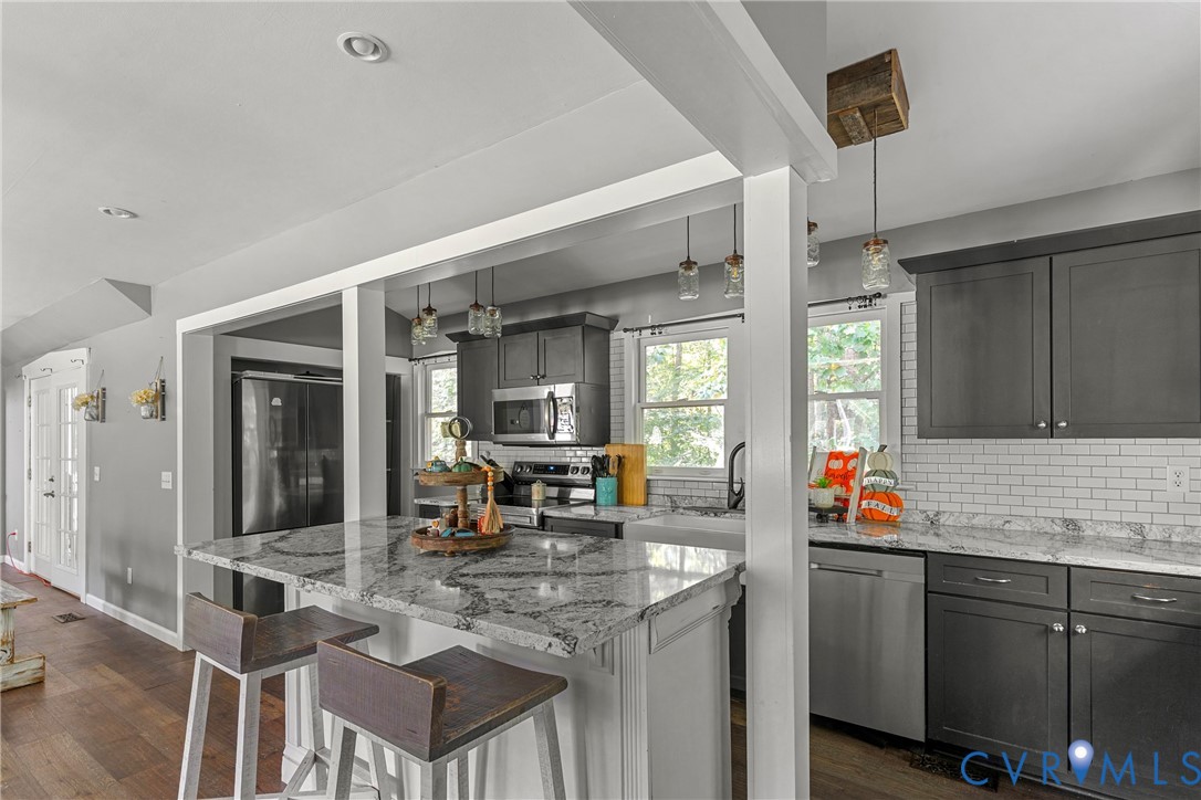 80 Mill Ridge Road Hartfield, VA 23071 - Photo 5 of 43 Kitchen featuring dark wood-finish cabinetry, ligh