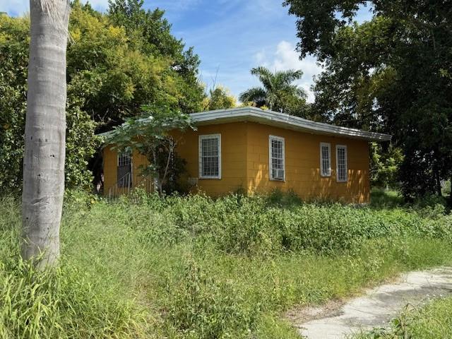 398 Cypress Avenue Pahokee, FL 33476 - Photo 1 of 1 a view of a house with a yard