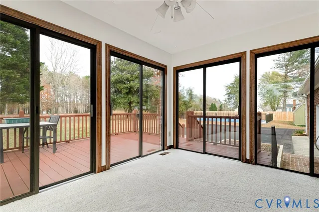 a view of a room with wooden floor and balcony