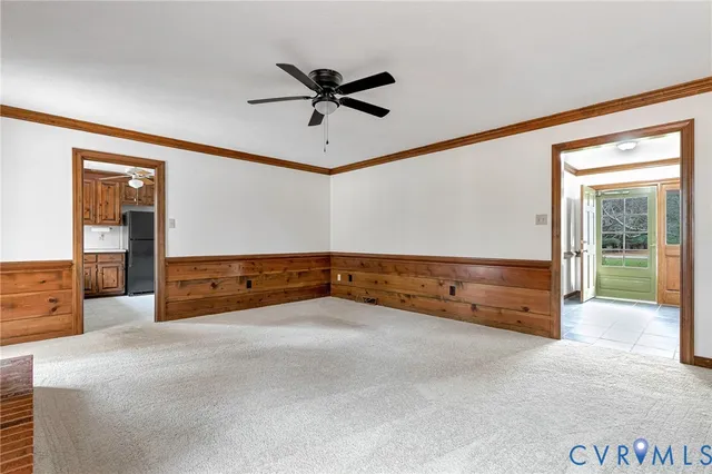 a view of room with window and a ceiling fan