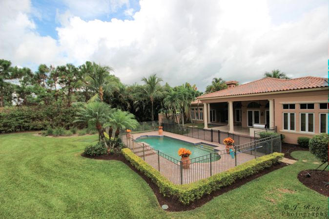 8246 Southeast Country Estates Way Jupiter, FL 33458 - Photo 42 of 48 Rear pool view