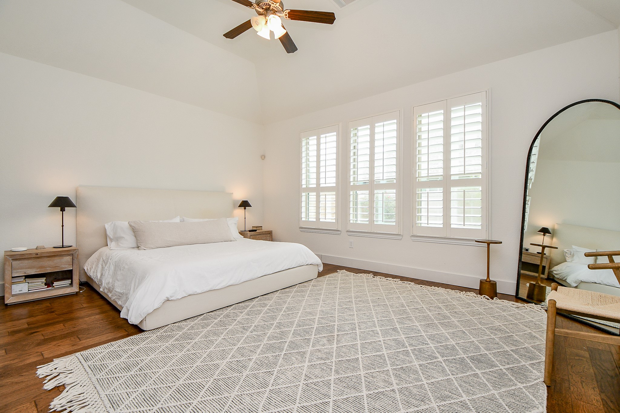 4523 Juniper Ridge Lane Manvel, TX 77578 - Photo 14 of 38 a bedroom with a large bed and a chandelier