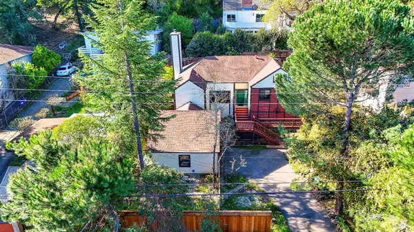 an aerial view of a house with yard table and chairs
