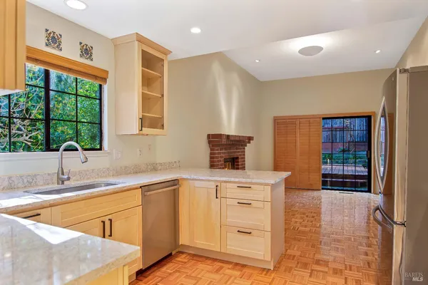 a kitchen with a sink stove and refrigerator