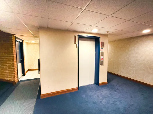 a view of hallway with a large window