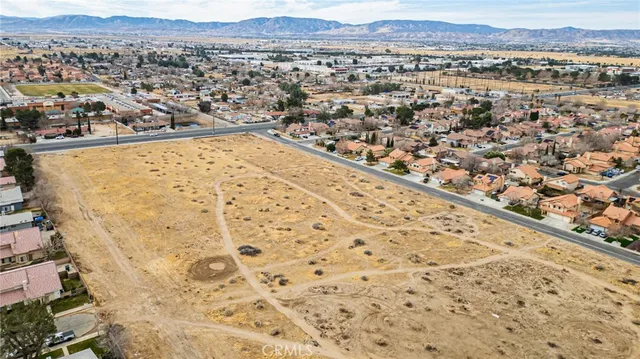 an aerial view of residential building and an ocean