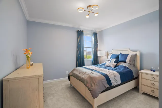 a bedroom with a bed and cabinets