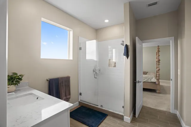 an aerial view of residential houses with outdoor space and swimming pool