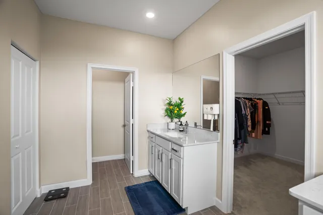 an aerial view of residential houses with outdoor space and swimming pool